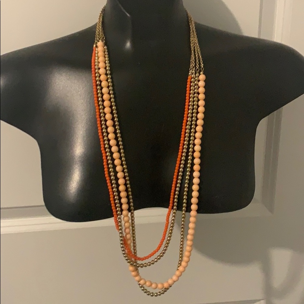 Long layered necklace.